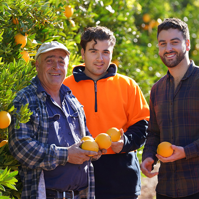 Nudie 3 Generation Farmers Holding Fresh Oranges
